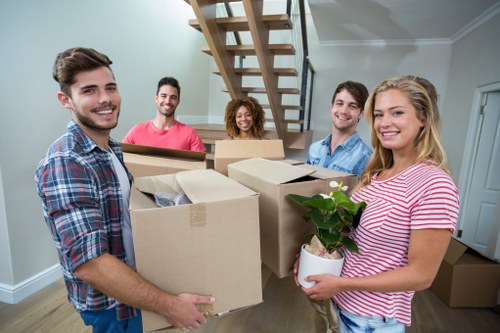 Professional movers handling furniture during pick-up in Scotland