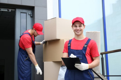Professional movers handling furniture