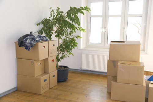 Packers carefully securing fragile furniture for transit