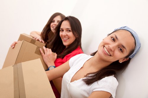 Professional removal team handling office equipment